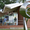 Zach Harris sculpture with Beau Rivage Gallery of African American Art in Background