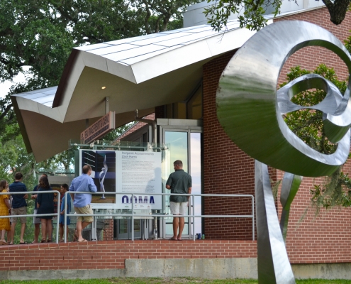 Zach Harris sculpture with Beau Rivage Gallery of African American Art in Background