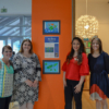 Teachers from West Wortham pose in front of The World Through My Eyes Gallery